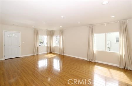 1007 Del Rey Avenue Pasadena, CA 91107 - Photo 3 of 15 a view of an empty room with wooden floor and a window