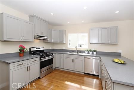 1007 Del Rey Avenue Pasadena, CA 91107 - Photo 5 of 15 a kitchen with stainless steel appliances granite countertop a sink a stove top oven a counter space and cabinets