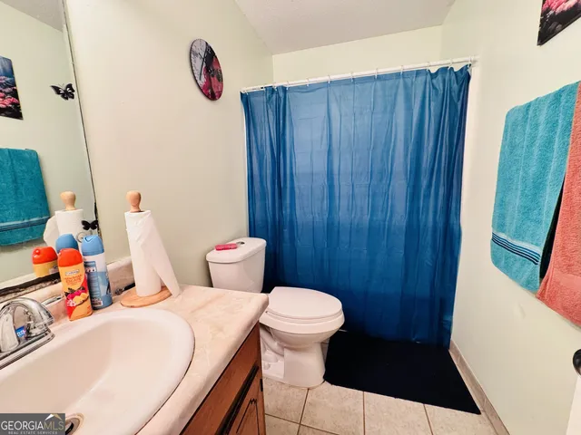 a bathroom with a toilet and a sink