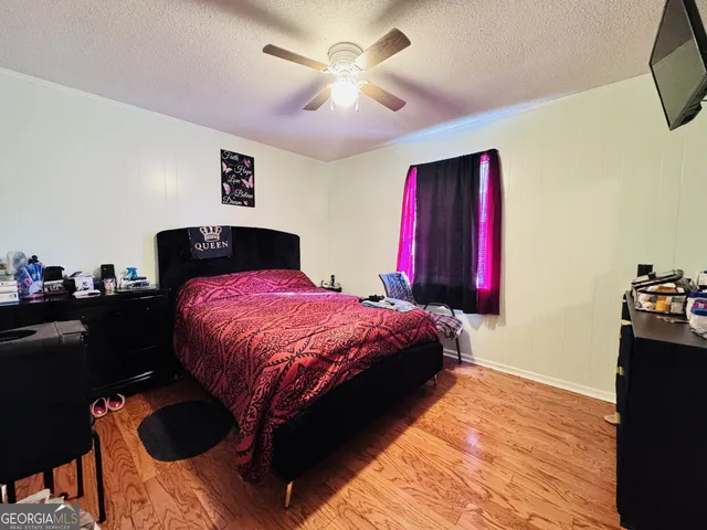 a bedroom with a bed and a closet