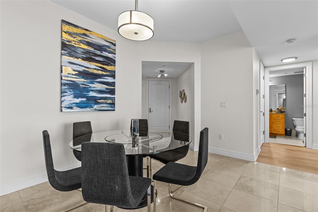 331 Cleveland Street, Unit 2102 Clearwater, FL 33755 - Photo 11 of 66 a view of a dining room with furniture