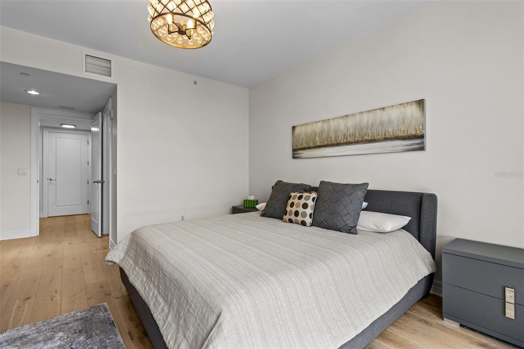 331 Cleveland Street, Unit 2102 Clearwater, FL 33755 - Photo 16 of 66 a bedroom with a bed and a window