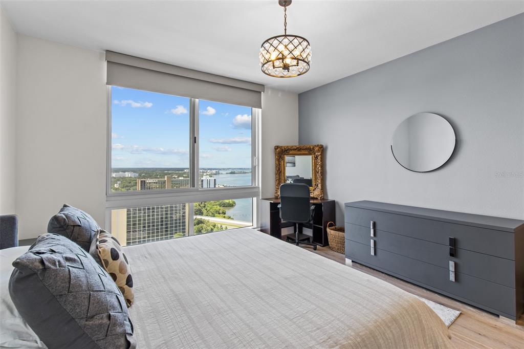 331 Cleveland Street, Unit 2102 Clearwater, FL 33755 - Photo 18 of 66 a bedroom with a bed and a large window