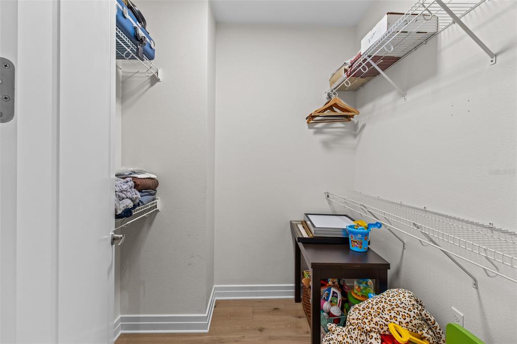 331 Cleveland Street, Unit 2102 Clearwater, FL 33755 - Photo 19 of 66 a view of walk in closet with clothes and shoes