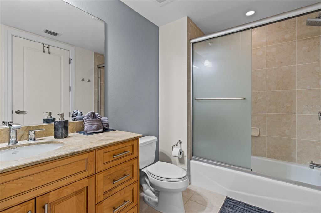 331 Cleveland Street, Unit 2102 Clearwater, FL 33755 - Photo 21 of 66 a bathroom with a sink toilet and shower