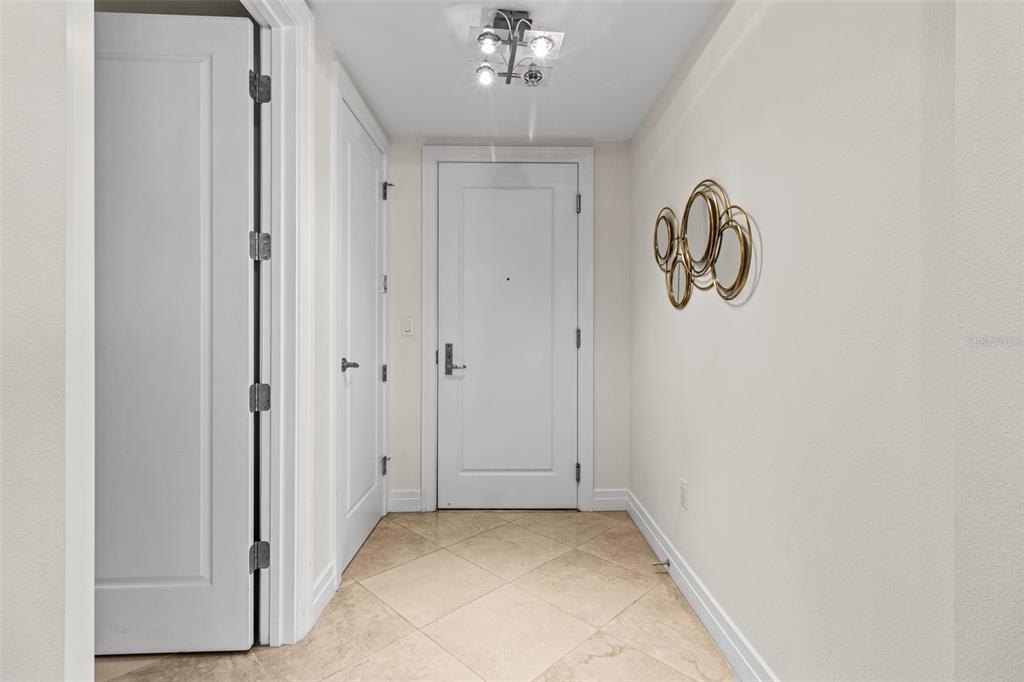 331 Cleveland Street, Unit 2102 Clearwater, FL 33755 - Photo 24 of 66 a view of a hallway with chandelier