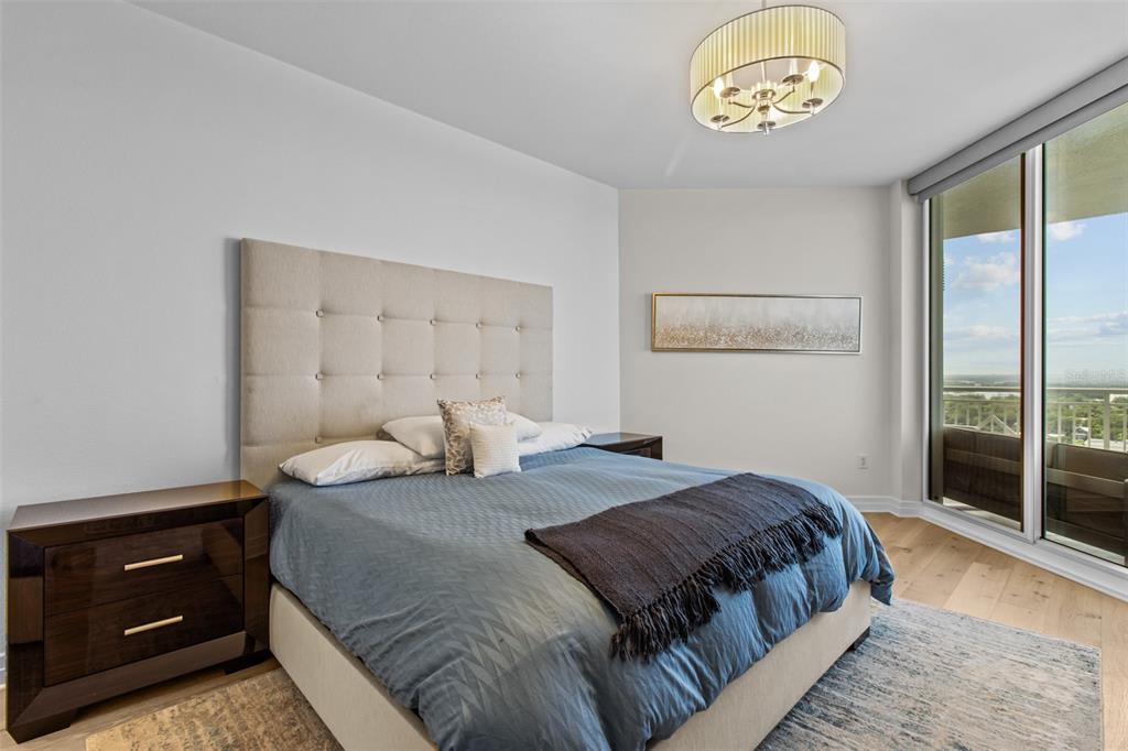 331 Cleveland Street, Unit 2102 Clearwater, FL 33755 - Photo 32 of 66 a bedroom with a bed and a window