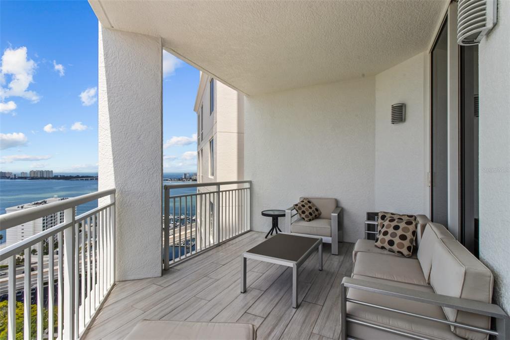 331 Cleveland Street, Unit 2102 Clearwater, FL 33755 - Photo 34 of 66 a view of a balcony with chair and table