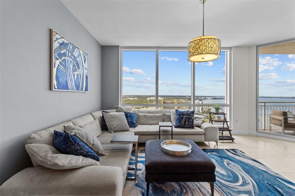 331 Cleveland Street, Unit 2102 Clearwater, FL 33755 - Photo 4 of 66 a living room with furniture and a large window