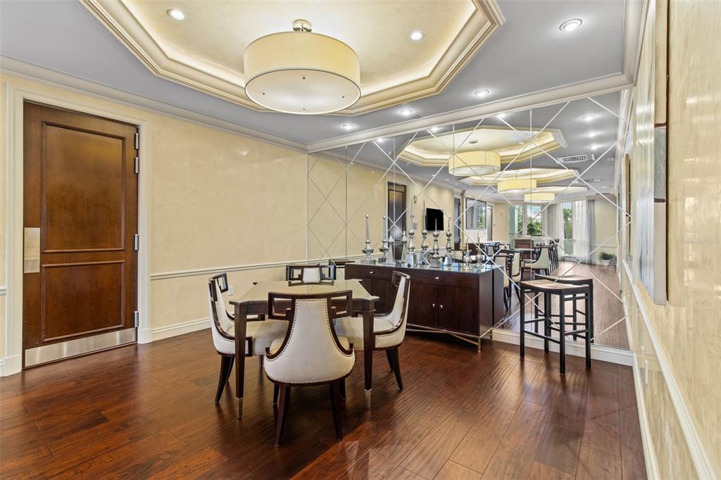 331 Cleveland Street, Unit 2102 Clearwater, FL 33755 - Photo 44 of 66 a view of a dining room with furniture and wooden floor