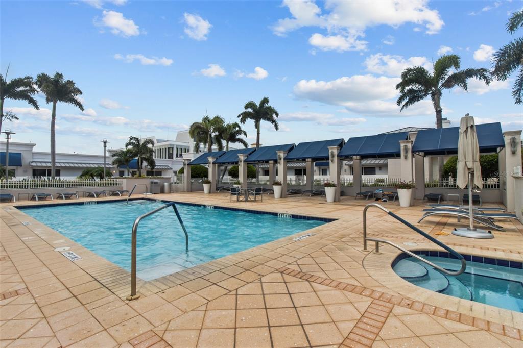 331 Cleveland Street, Unit 2102 Clearwater, FL 33755 - Photo 51 of 66 a view of a swimming pool with a lounge chairs