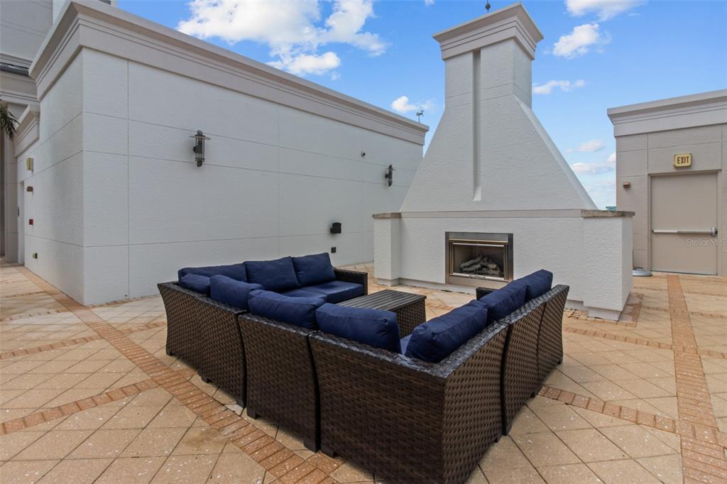331 Cleveland Street, Unit 2102 Clearwater, FL 33755 - Photo 53 of 66 a living room with furniture and a fireplace