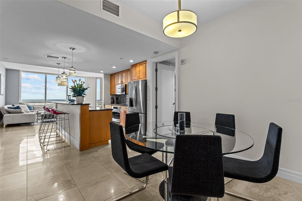 331 Cleveland Street, Unit 2102 Clearwater, FL 33755 - Photo 10 of 66 a view of a dining room with furniture window and outside view