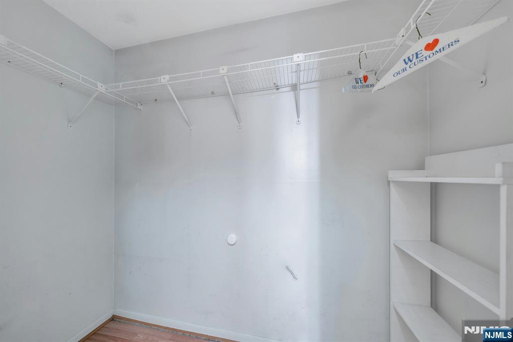 666 Mill Street, Unit C6 Belleville, NJ 07109 - Photo 16 of 25 a view of walk in closet with empty racks