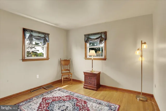 a living room with furniture and a rug