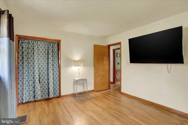 a view of livingroom with furniture and flat screen tv