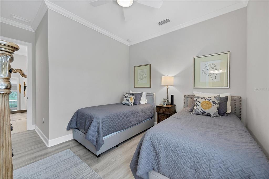 4735 Cassio Court Bradenton, FL 34211 - Photo 23 of 100 a bedroom with two beds and a night stand