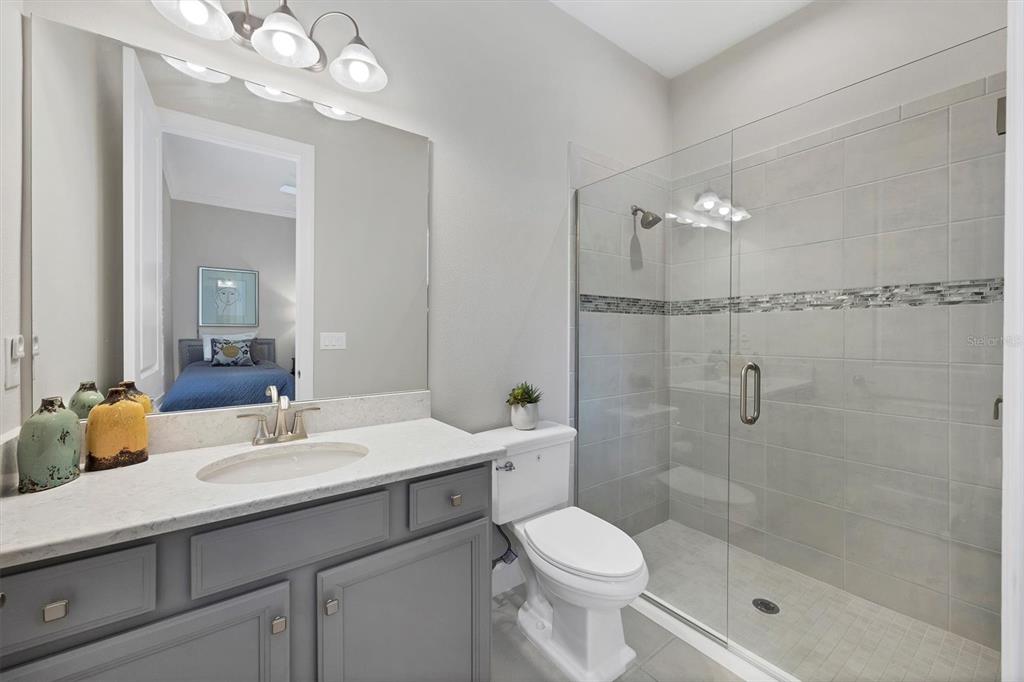 4735 Cassio Court Bradenton, FL 34211 - Photo 24 of 100 a bathroom with a sink a toilet and shower