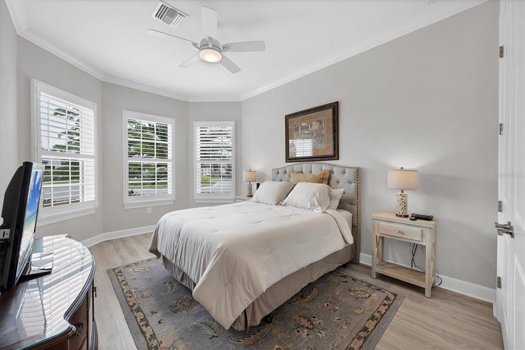 4735 Cassio Court Bradenton, FL 34211 - Photo 25 of 100 a bedroom with a bed wooden floor and a window