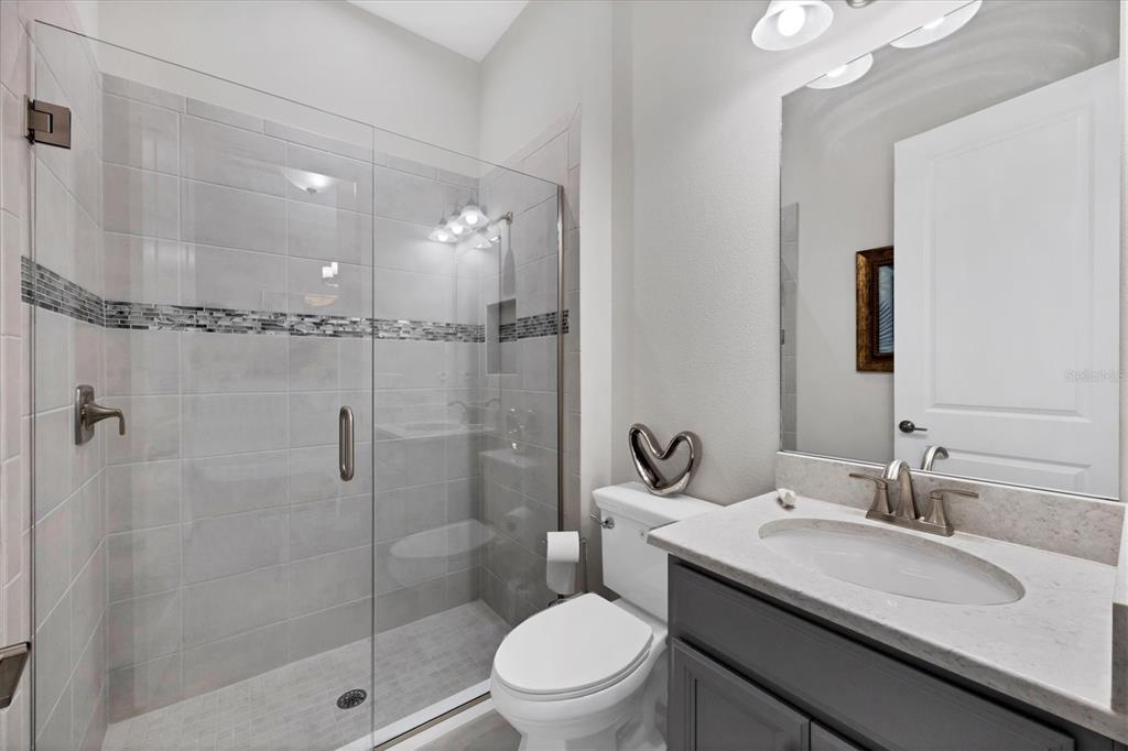 4735 Cassio Court Bradenton, FL 34211 - Photo 27 of 100 a bathroom with a sink toilet and shower