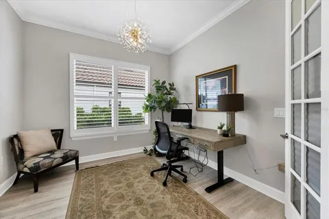an aerial view of a house with a yard and lake view