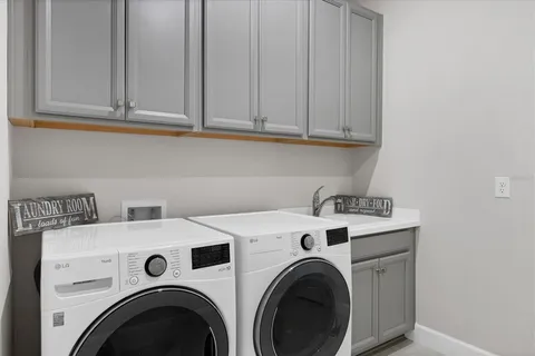 a view of a house with a small yard and plants