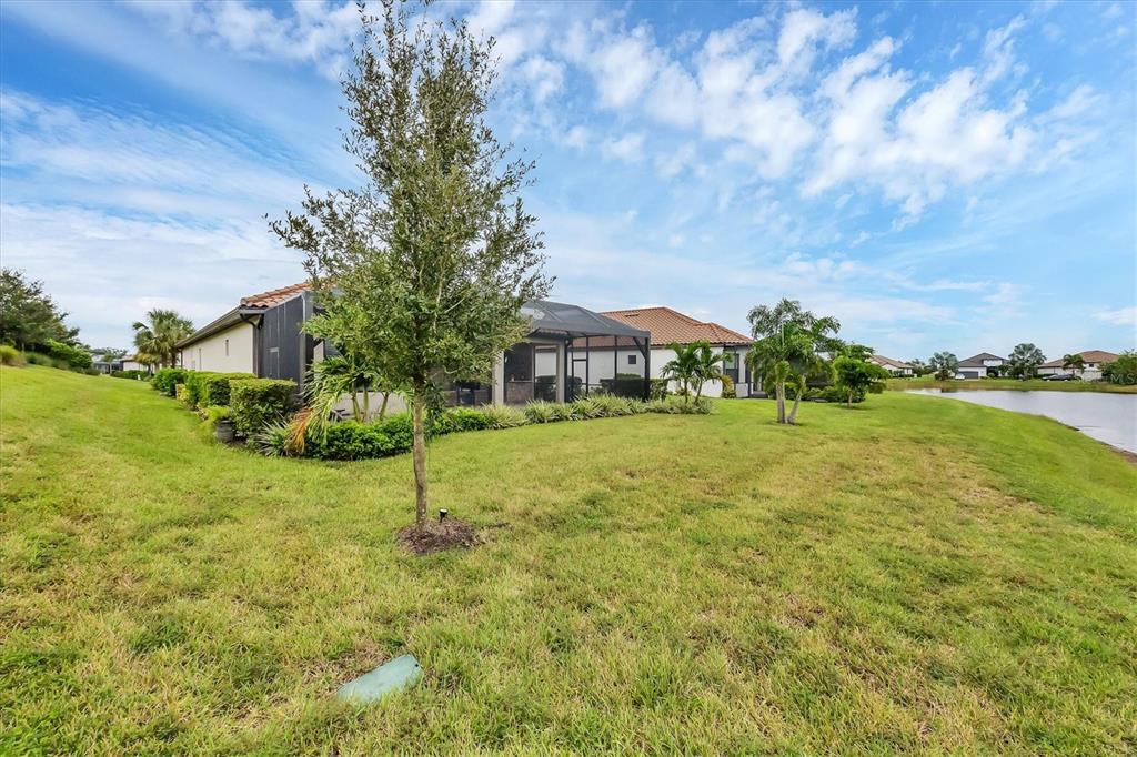4735 Cassio Court Bradenton, FL 34211 - Photo 40 of 100 a house view with garden space