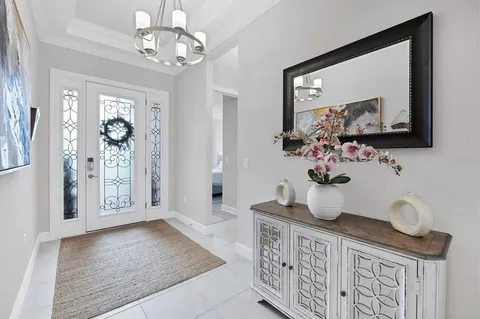 a living room with furniture and kitchen view
