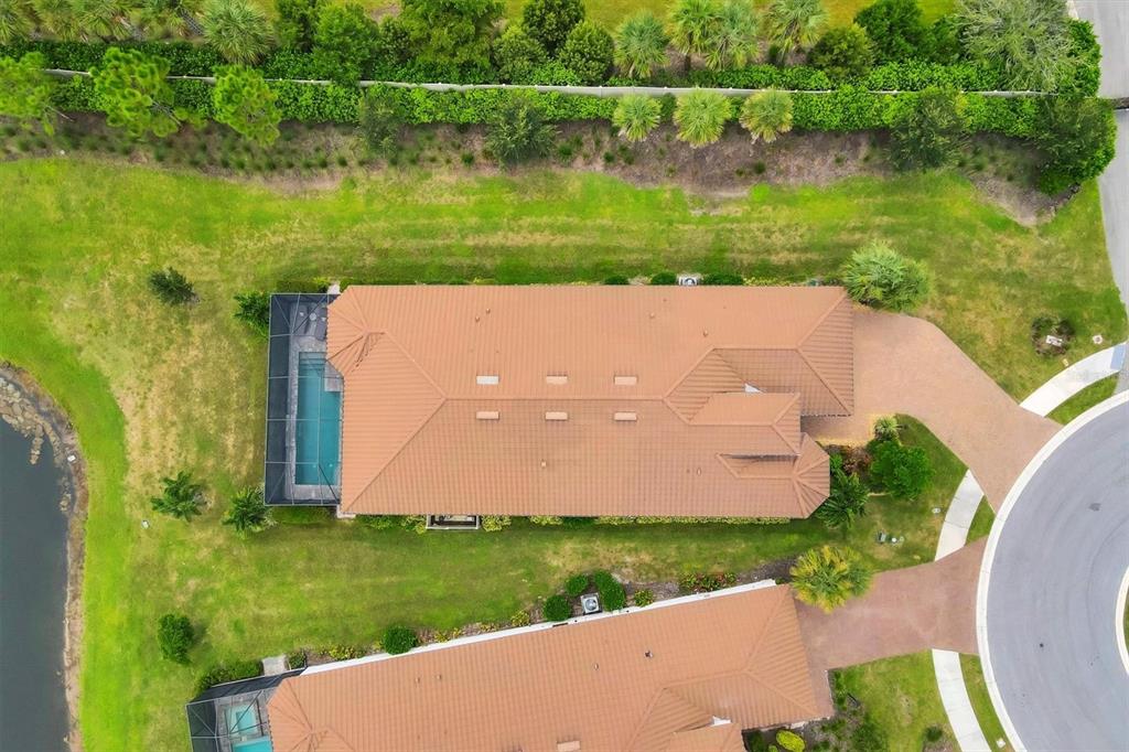 4735 Cassio Court Bradenton, FL 34211 - Photo 45 of 100 an aerial view of a house with a yard and lake view