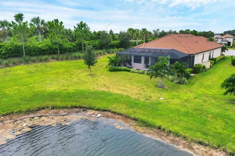 a living room with furniture and potted plant