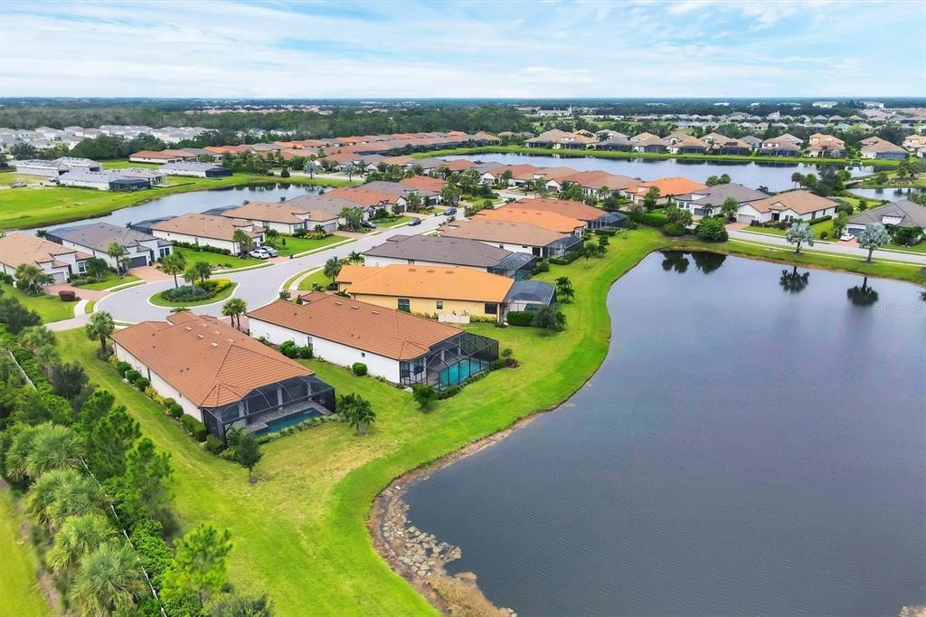 4735 Cassio Court Bradenton, FL 34211 - Photo 47 of 100 an aerial view of a houses with a swimming pool