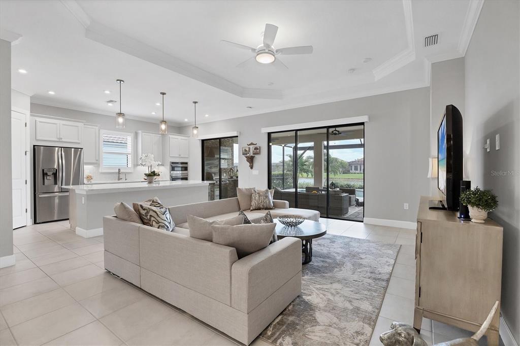 4735 Cassio Court Bradenton, FL 34211 - Photo 6 of 100 a living room with furniture and kitchen view