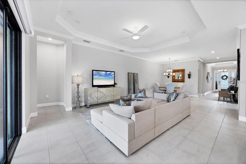 4735 Cassio Court Bradenton, FL 34211 - Photo 7 of 100 a living room with furniture and a view of bedroom