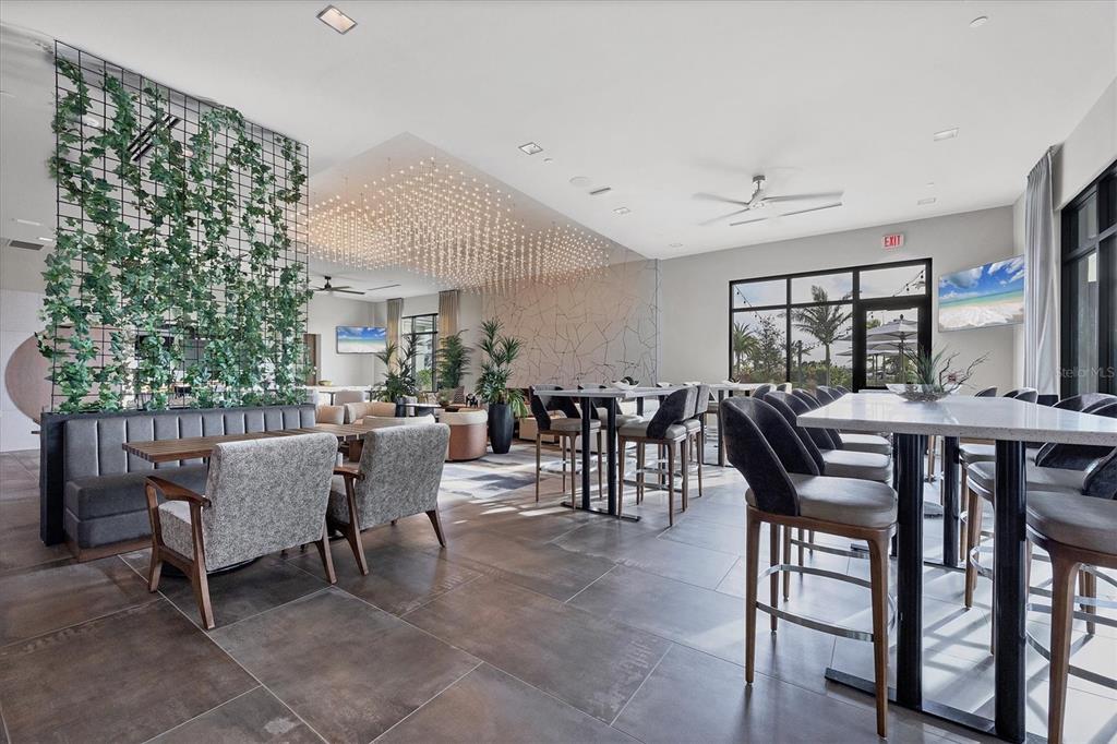 4735 Cassio Court Bradenton, FL 34211 - Photo 90 of 100 a view of a dining room with furniture and a potted plant