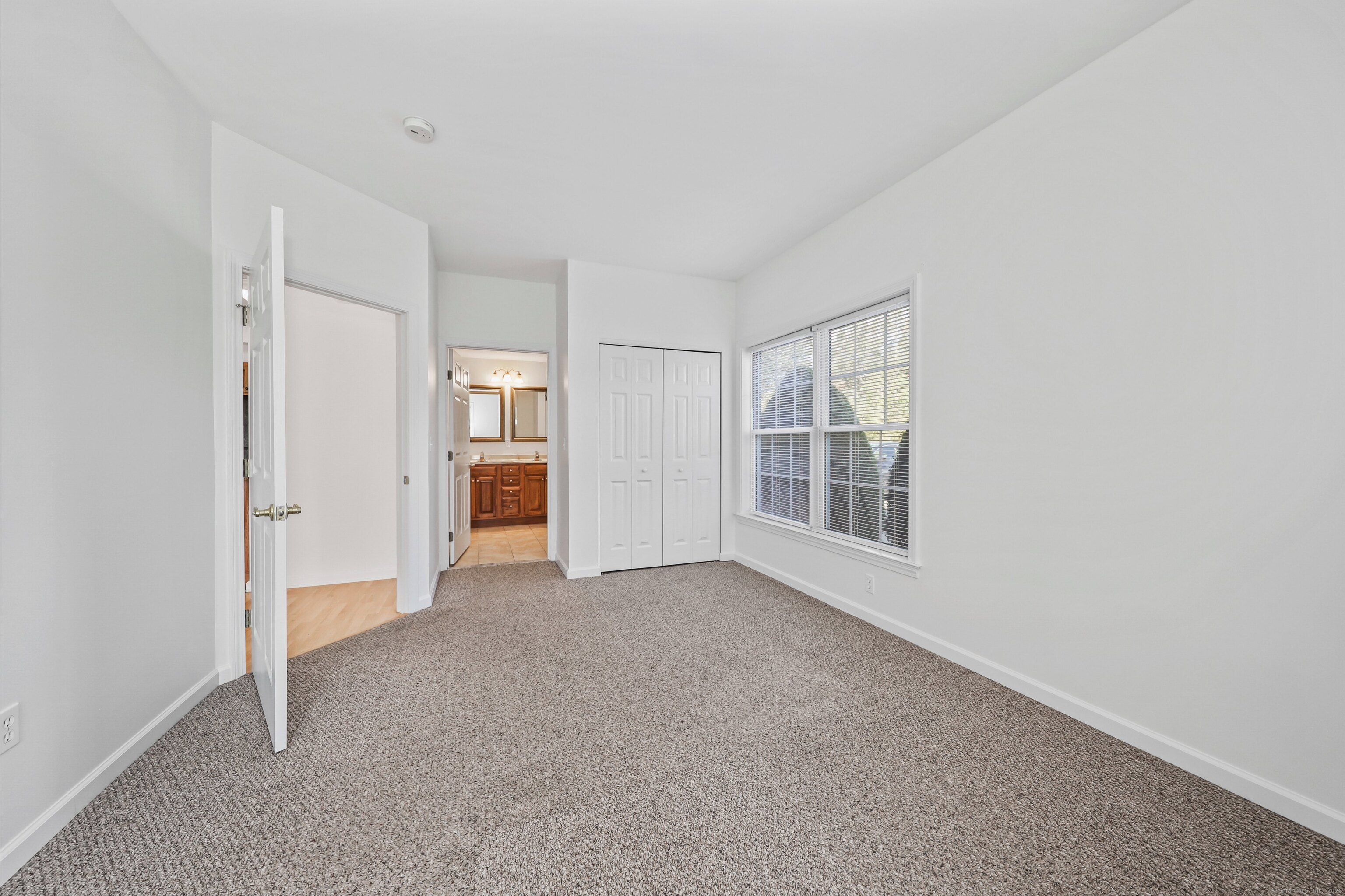 211 Pine Hill Boulevard, Unit 211 Plymouth, CT 06782 - Photo 14 of 35 a view of an empty room with an entryway