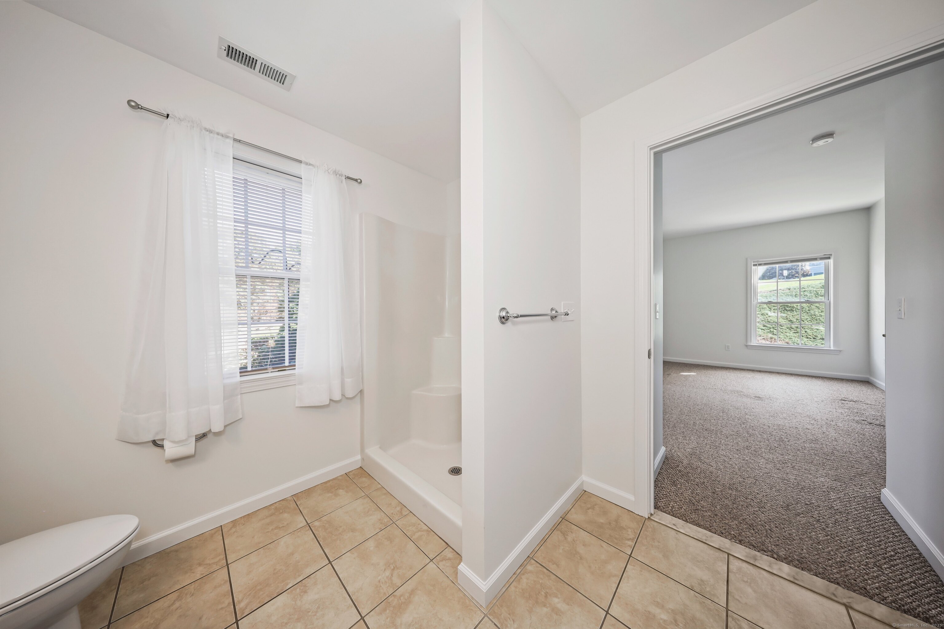 211 Pine Hill Boulevard, Unit 211 Plymouth, CT 06782 - Photo 16 of 35 a view of room with window and hardwood floor