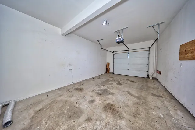 a view of a house with a yard and garage