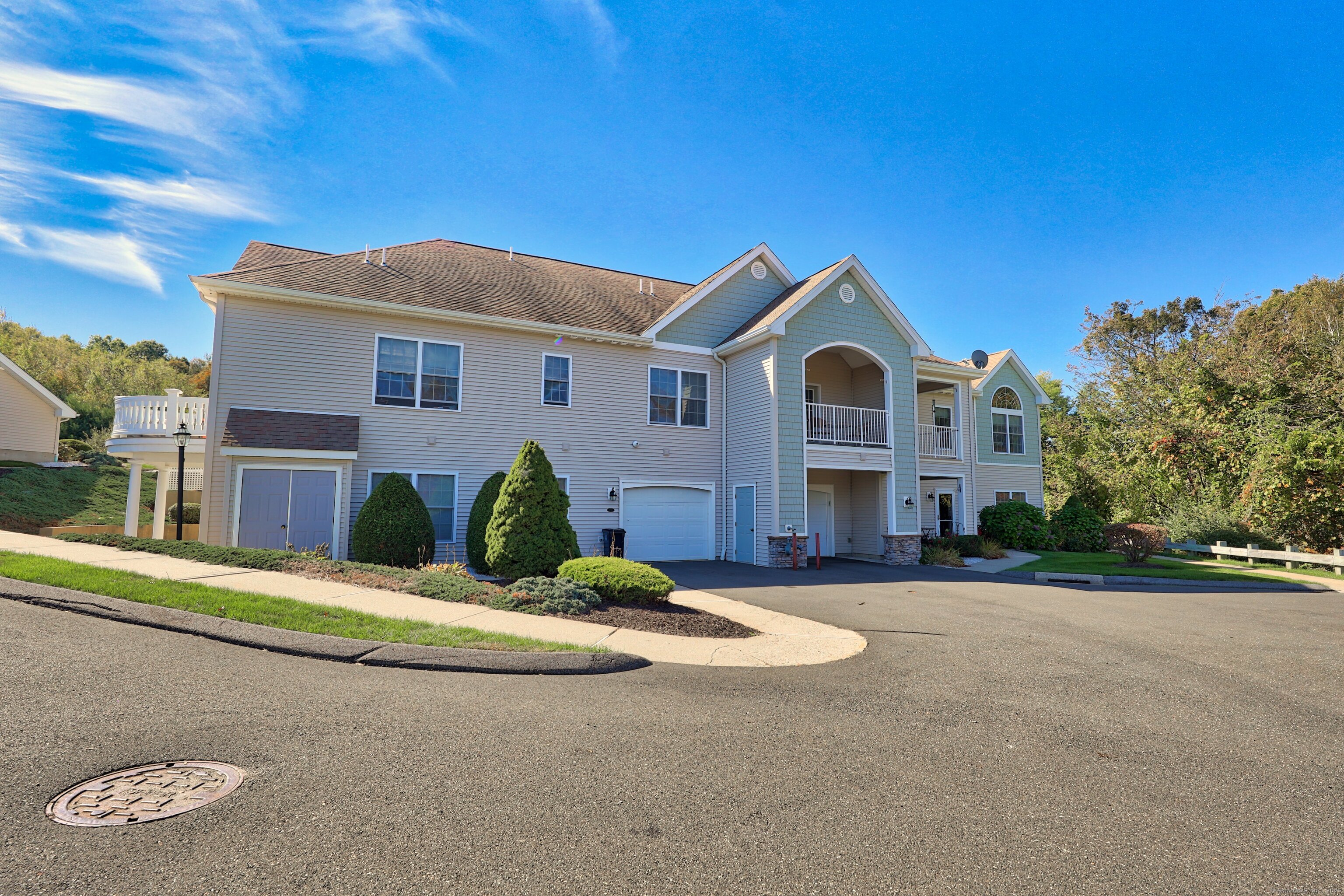 211 Pine Hill Boulevard, Unit 211 Plymouth, CT 06782 - Photo 24 of 35 a view of a house with a small yard and potted plants