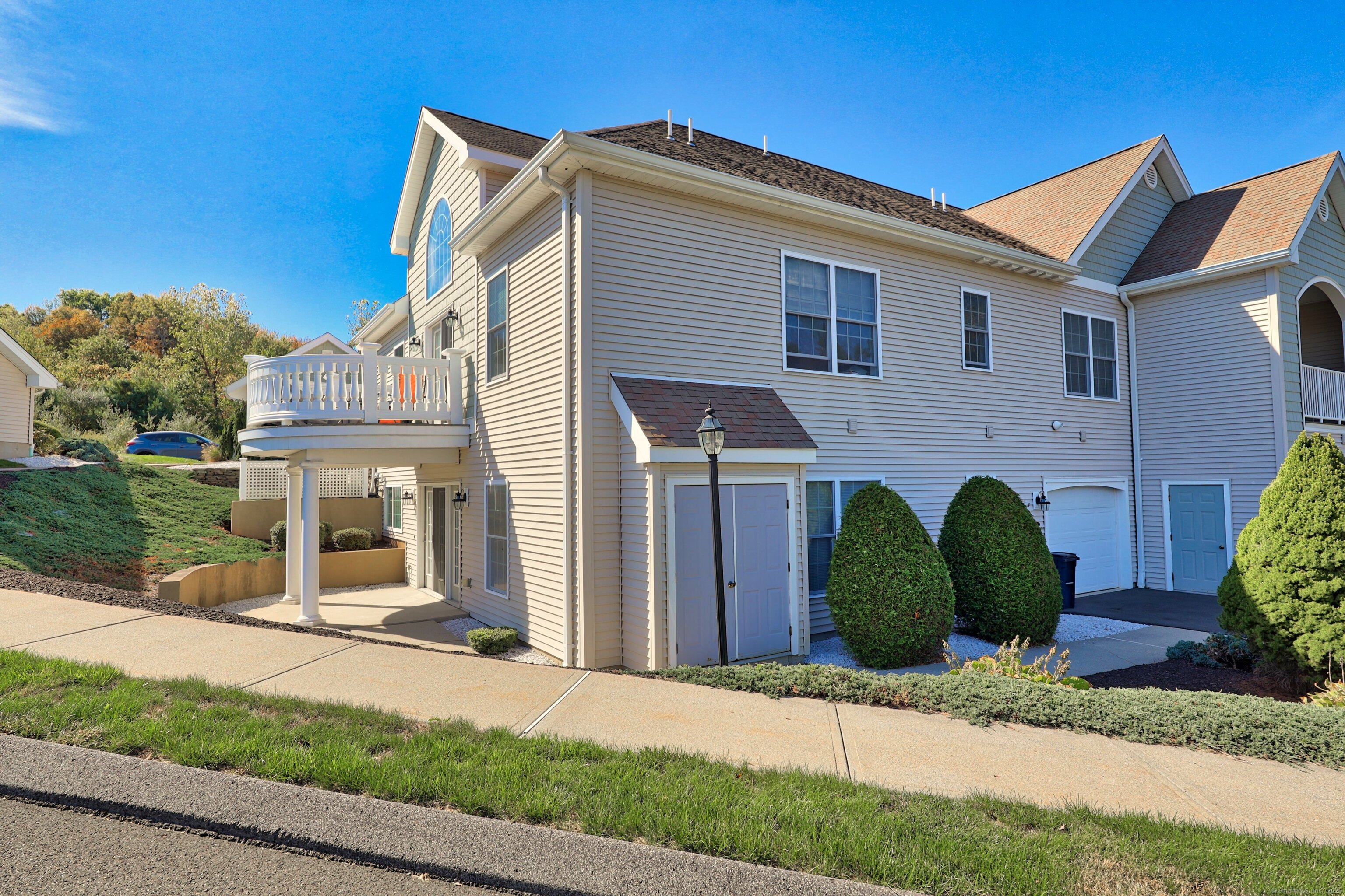 211 Pine Hill Boulevard, Unit 211 Plymouth, CT 06782 - Photo 26 of 35 a front view of a house with garden
