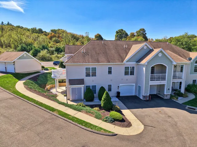 an aerial view of residential building with an outdoor space