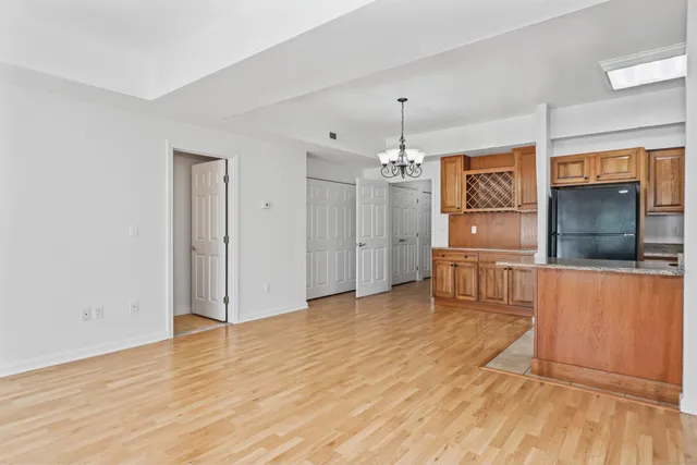 a kitchen with stainless steel appliances granite countertop a stove top oven a sink and a microwave