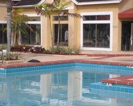15591 Southwest 105th Terrace, Unit 515 Miami, FL 33196 - Photo 2 of 4 a view of house with outdoor space