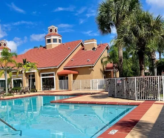 a front view of a house with swimming pool