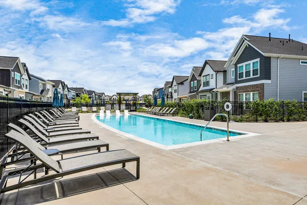 a view of a patio with swimming pool table and chairs