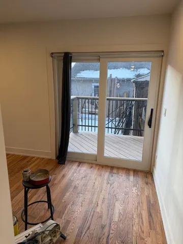 a view of room with wooden floor and chair