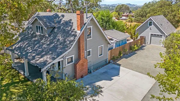 a aerial view of a house with a yard