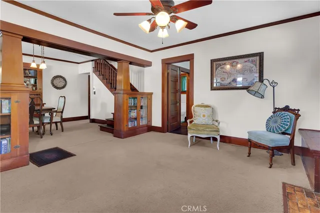 a view of a dining room with furniture window and chandelier