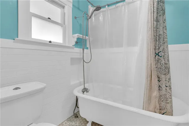 a workspace with furniture and chandelier