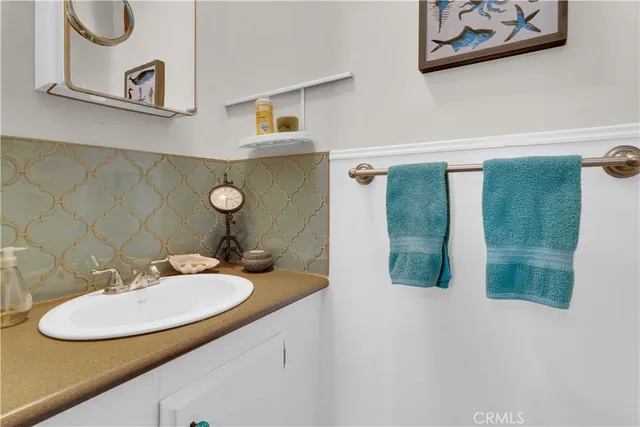 a view of an empty room with window and fan