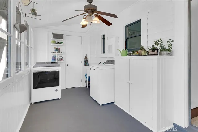 a view of a house with wooden fence